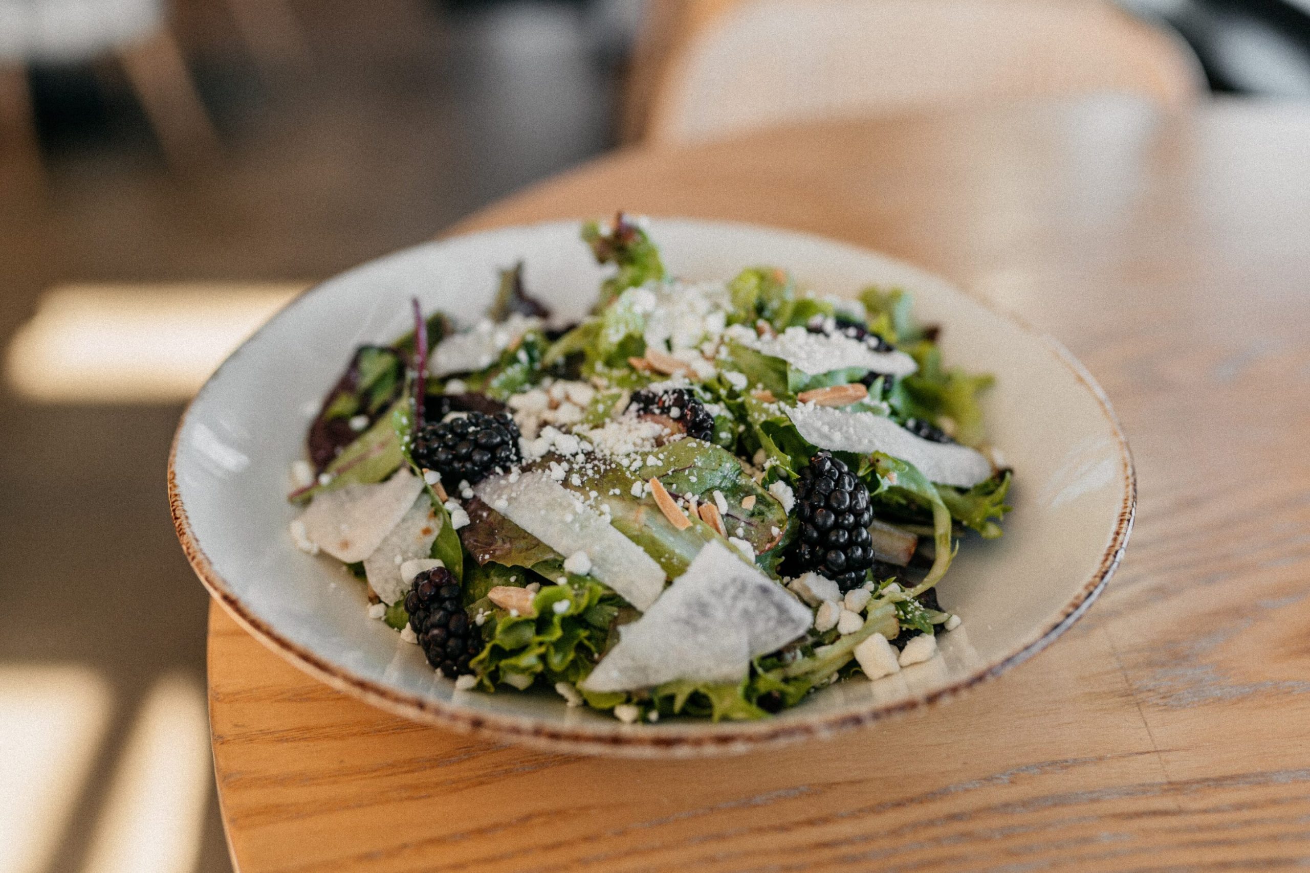 Blackberry Field Salad Blackberry Field Salad with mixed greens, shaved jicama, blackberries, toasted almonds, goat cheese, honey lemon vinaigrette