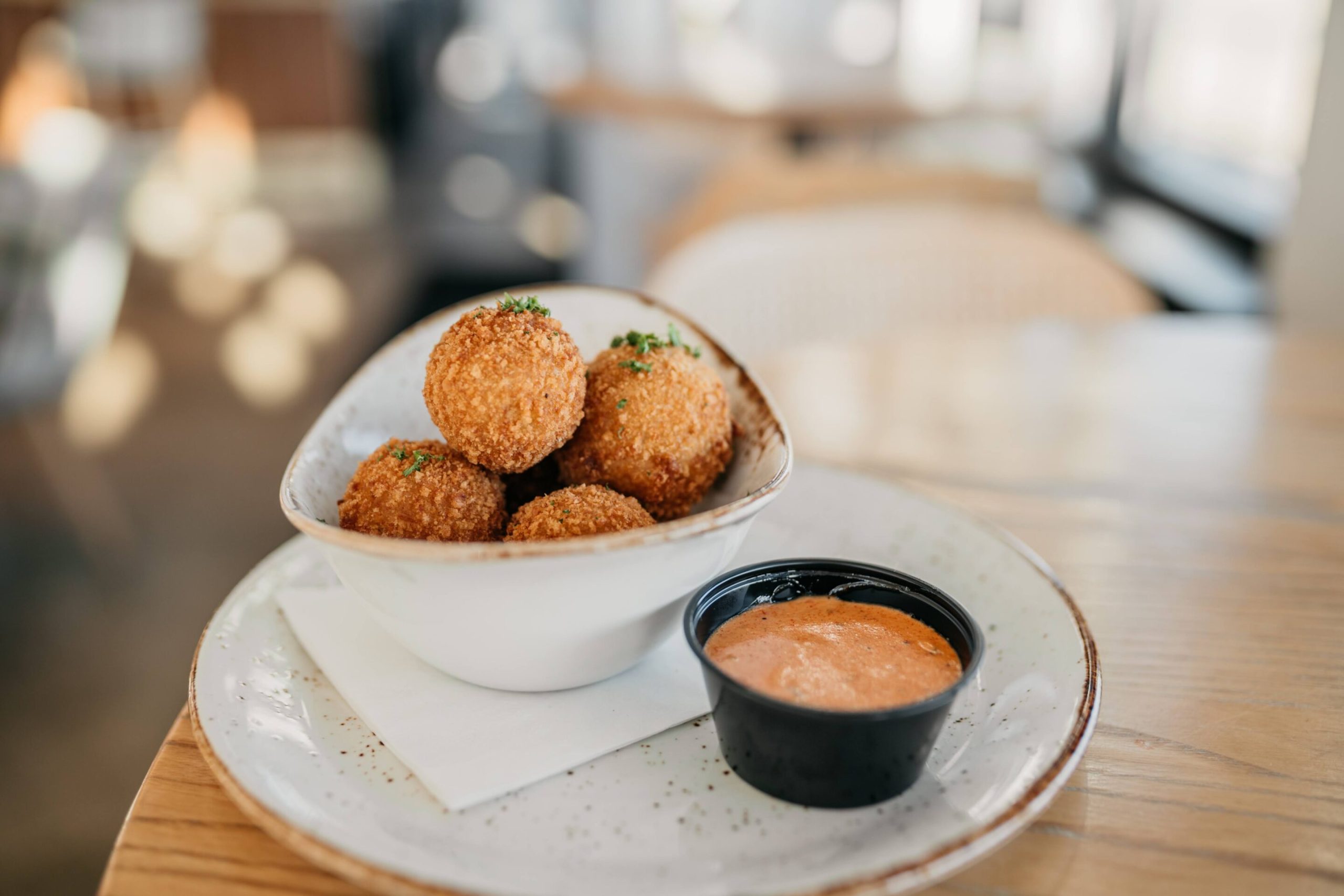 Ham & Swiss Poppers Ham & Swiss Poppers with country ham, gruyere swiss, panko-breaded, pickle comeback sauce